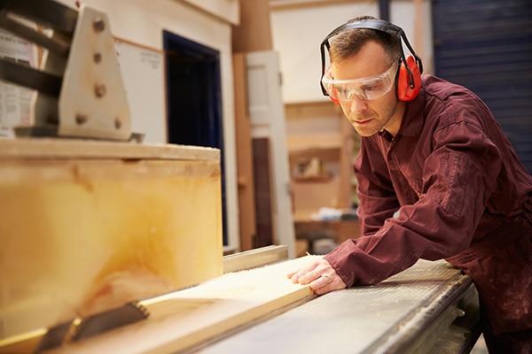 Man cutting board with table saw