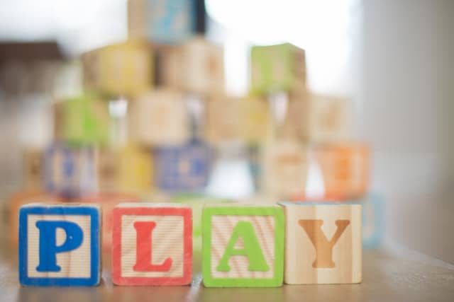 Play spelled out in block letters